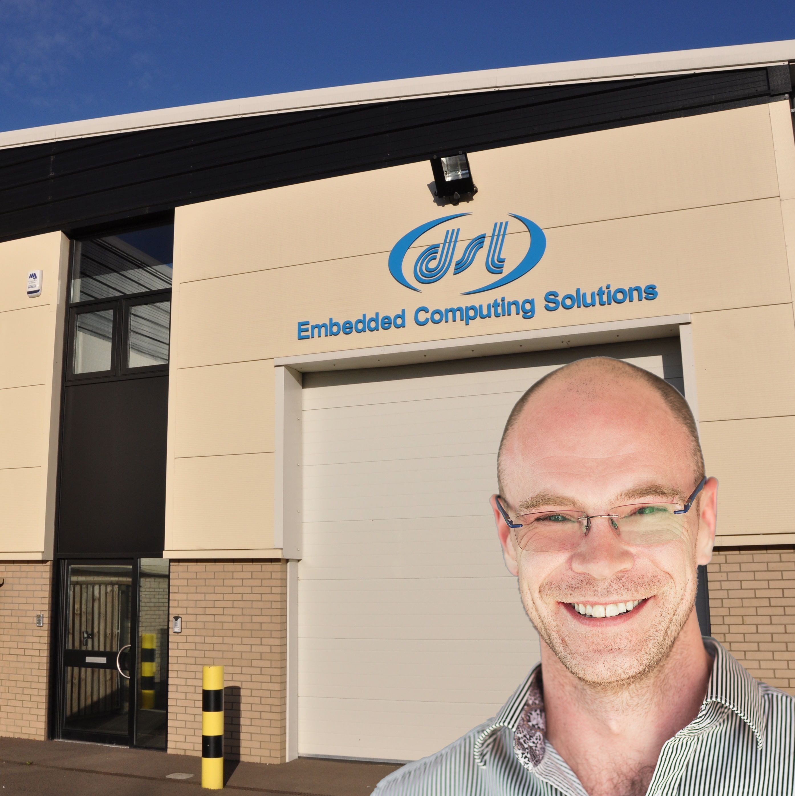 Rory Dear outside DSL, with the company’s signage above him
